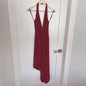 Red halter-neck, asymmetric hem, jersey dress with a plunging neckline